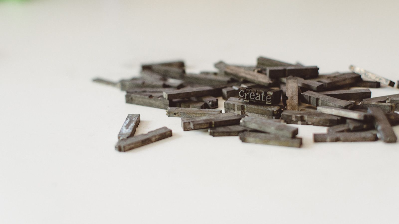 Vintage letterpress type blocks spelling 'CREATE', representing the process of learning to build static sites and blogs with Gatsby's modern development tools